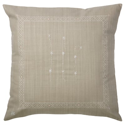 An IKEA ÅKERNEJLIKA beige square cushion cover with hand-embroidered floral designs and geometric borders, made from 100% cotton.