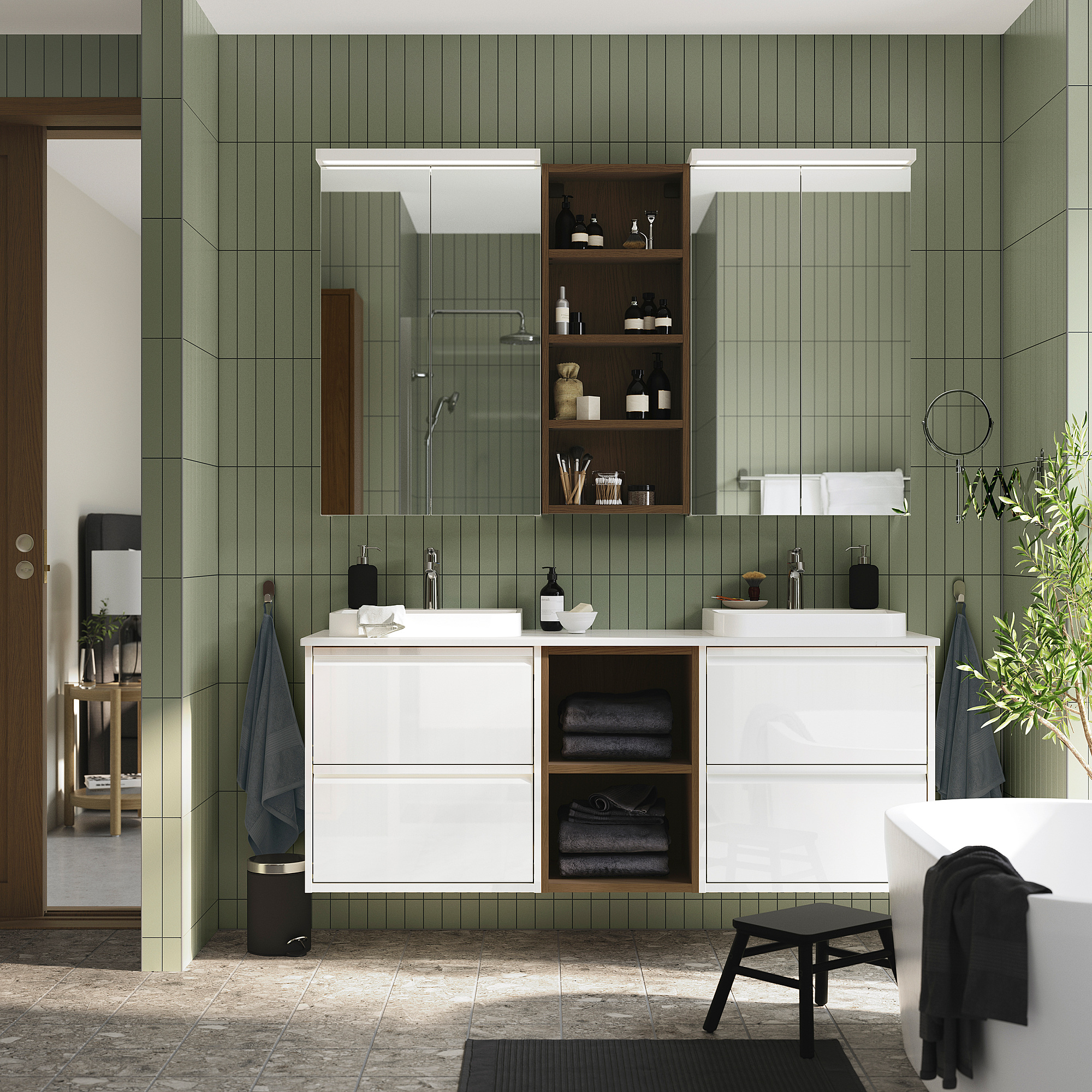 Modern bathroom with ÄNGSJÖN vanity, marble top, open shelves, green tiles, glass shower.
