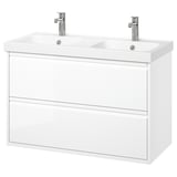 Its a white, wall-mounted dual sink bathroom vanity with modern design, two drawers, and chrome faucets.
