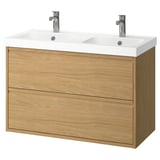 Modern dual oak-wood vanity with white ceramic sinks and chrome faucets, wall-mounted.