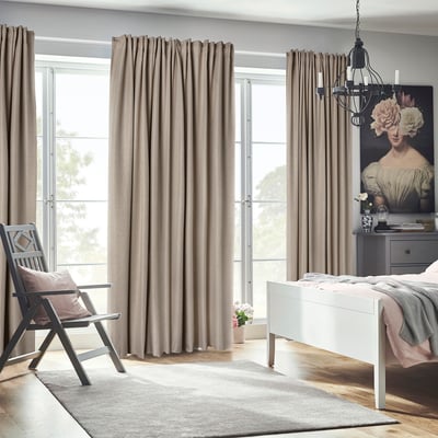 Modern bedroom with ANNAKAJSA curtains, floor-to-ceiling, offering privacy and minimalist decor.