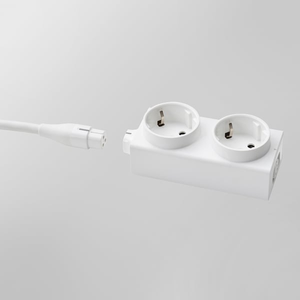 White electrical extension cord with dual outlets and a connected plug. Indoor, flexible power solution.