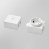 Two white ikea ÅSKVÄDER modules: a wireless on/off switch and a power outlet, arranged side by side.