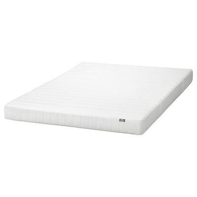 White IKEA ASPSJÖKULLEN foam mattress, rectangular, smooth cover.