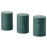 Three green AVMÅLA candles, cylindrical, textured, on white background. Made of plant-based and paraffin wax.