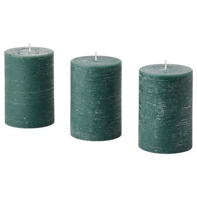 Three green AVMÅLA candles, cylindrical, textured, on white background. Made of plant-based and paraffin wax.