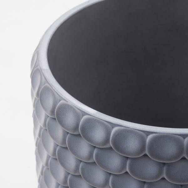 Concrete planter with felt pads close-up.