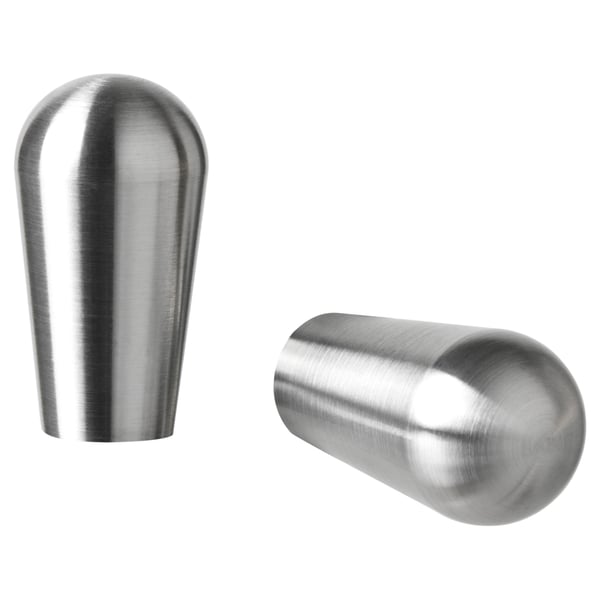 Two sleek, metallic, rounded silver knobs, one upright, one angled, showcasing modern design.