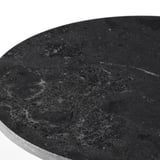 Close-up of smooth, dark marble cake stand, showcasing intricate speckled patterns and polished finish.