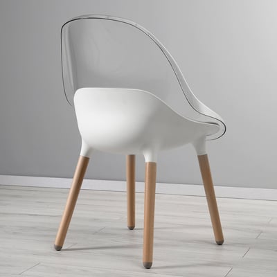 Transparent acrylic chair with wooden legs and gray cushion. Modern, minimalist design, stylish and comfortable.