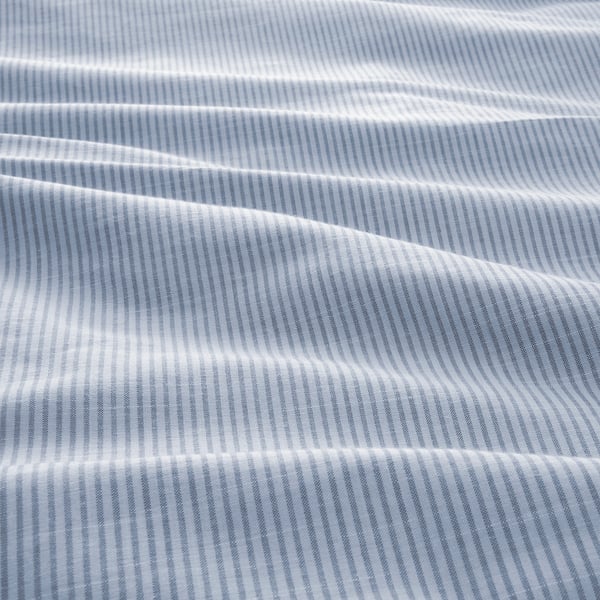 Close-up of soft, striped cotton duvet cover showcasing vibrant, handcrafted stripes and fine stitching.
