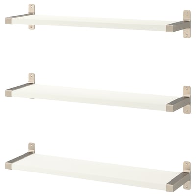 White wall shelves with nickel brackets, minimalist design.