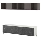 A modern BESTÅ tv unit in white and black marble. It a low cabinet with drawers and an open shelf unit above.