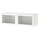 A white BESTÅ unit with two glass doors. Its rectangular, made of particleboard and glass, featuring a minimalist design.