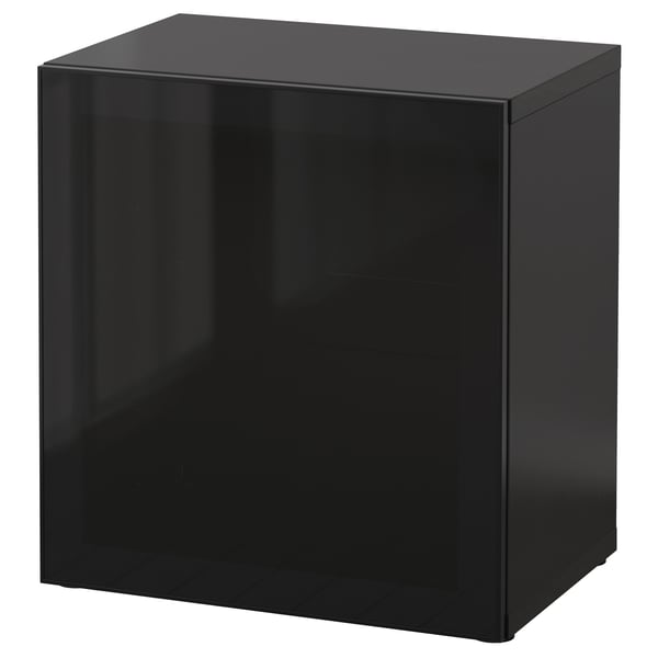 A black BESTÅ storage unit with a sleek, modern design featuring a glass door.