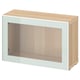 Light wood BESTÅ cabinet with glass door.