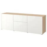 A BESTÅ sideboard, white and oak, featuring storage drawers and shelves. Its a modern and practical piece of furniture.