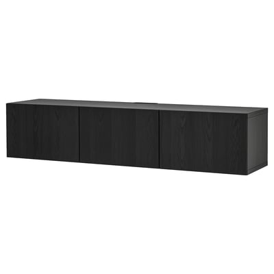 A black BESTÅ tv bench with four doors, providing ample storage. The modern design clean lines and a sleek finish, perfect for contemporary spaces.