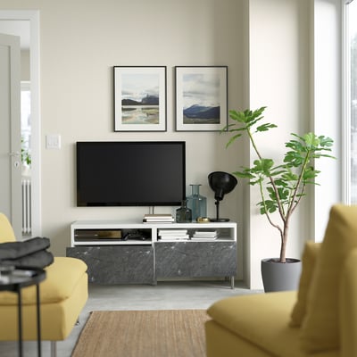 Modern living room with a BESTÅ tv unit featuring cable management, soft-close drawers, and a sleek design.