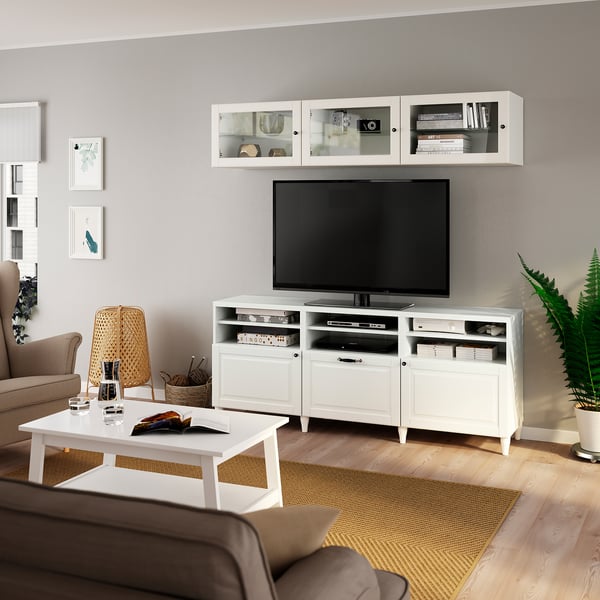 Modern living room with BESTÅ tv unit, brown sofa, and greenery.