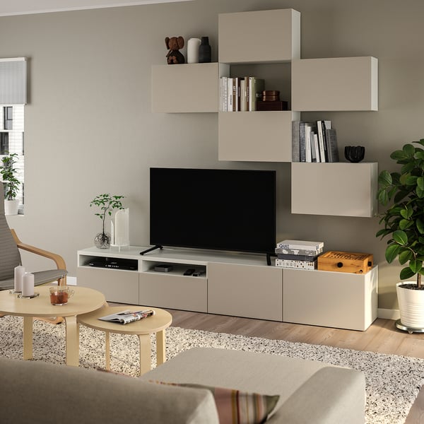 Cozy living room with BESTÅ tv unit, books, decor, and plant.