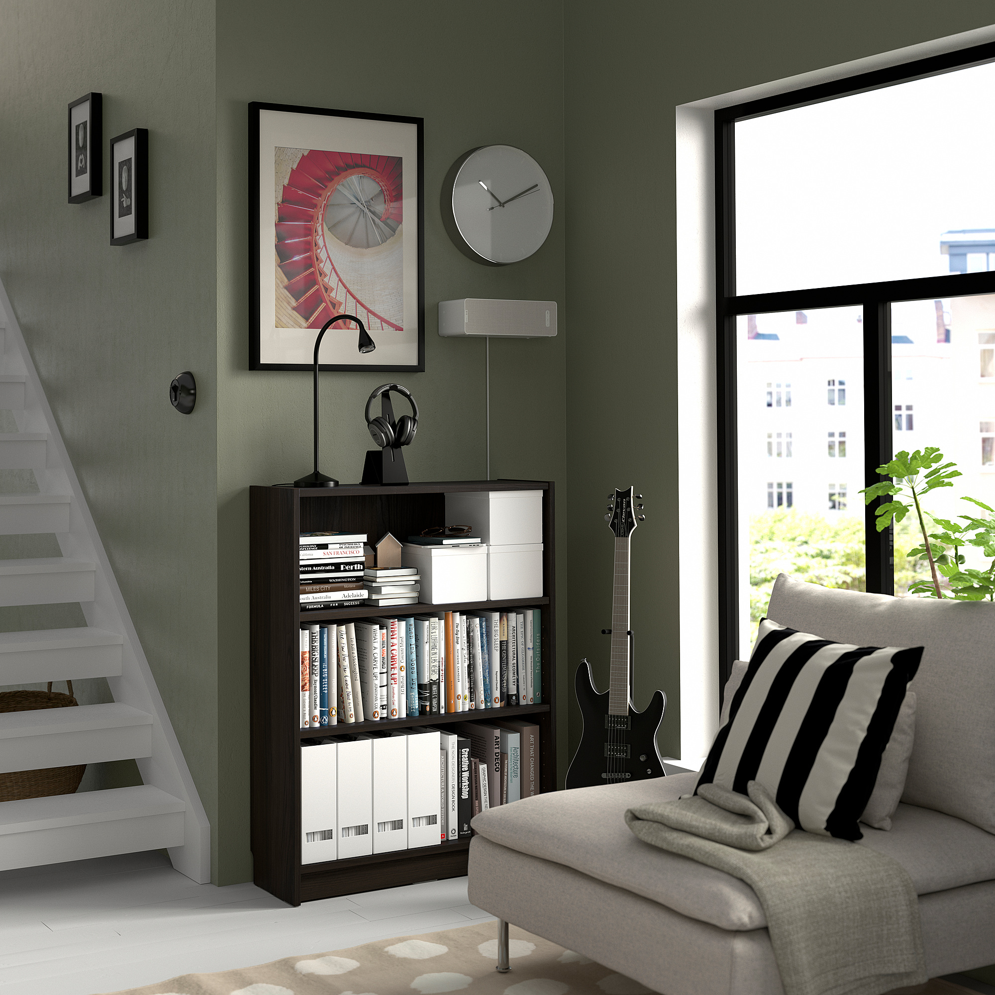 Cozy room with green wall, BILLY bookcase, white couch, guitar, city view window, clock, art, headphones