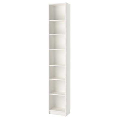 A white BILLY bookshelf. It is tall and slim, designed with multiple adjustable shelves for storage.