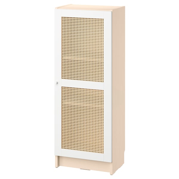 An ikea BILLY bookcase with a white and bamboo woven door. Its tall, rectangular, and includes a single door with a natural, textured bamboo panel.