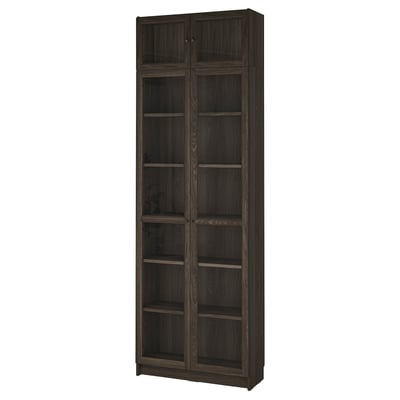 Tall, dark brown BILLY bookshelf with glass doors, eight shelves.