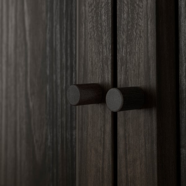 Dark wooden door with two round, black cylindrical door handles, centered and evenly spaced.