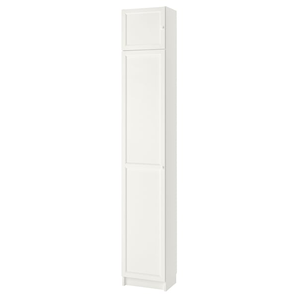 This image shows a white BILLY bookcase, a vertical storage unit with two adjustable shelves behind panel doors.