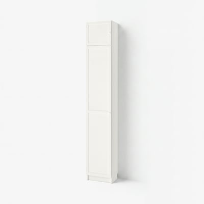 A tall, white BILLY bookcase with adjustable shelves and panel doors, standing against a white wall.