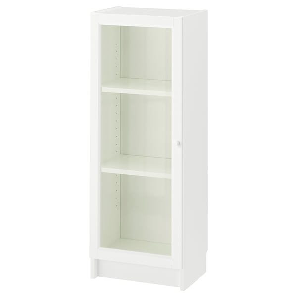 A white BILLY bookcase with glass doors. It has three shelves and a sleek, modern design.