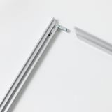 Close-up of sleek, modern frame corner with secure metal joints.