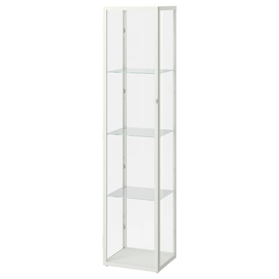A white ikea BLÅLIDEN glass-door cabinet. Its slim, tall, with four glass shelves for displaying items neatly.
