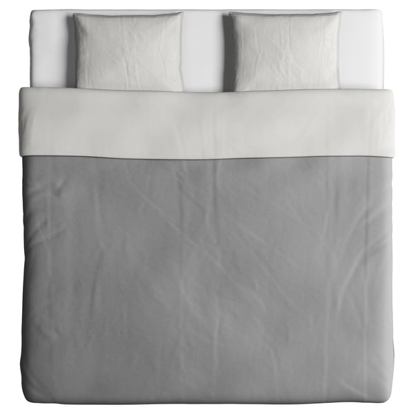 A BLÅVINDA duvet cover in white, made of cotton. It different patterns on each side, with a zipper closure.