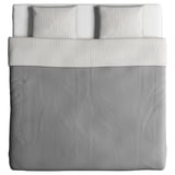 A BLÅVINDA duvet cover in white, made of cotton. It different patterns on each side, with a zipper closure.