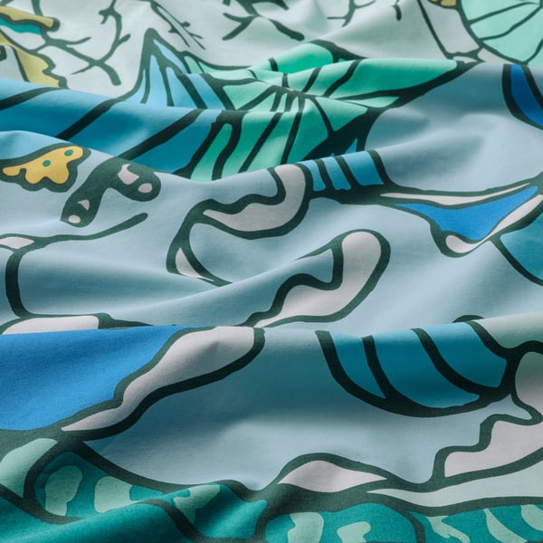 Vibrant cotton-viscose fabric with playful turtles and calming waves print, crisp weave, vivid colors.