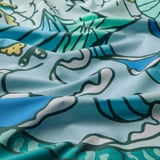 Vibrant cotton-viscose fabric with playful turtles and calming waves print, crisp weave, vivid colors.