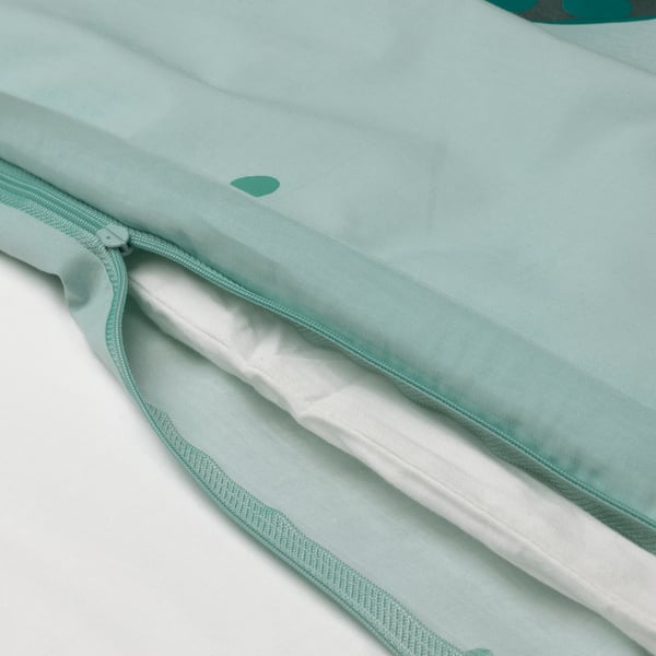 Close-up of zipper on light blue duvet, showcasing easy-to-use feature.