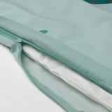 Close-up of zipper on light blue duvet, showcasing easy-to-use feature.