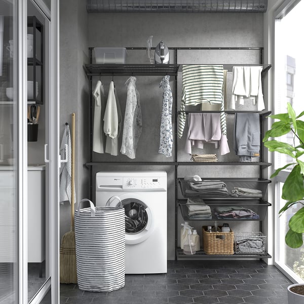 BOAXEL wall storage in laundry area with mesh baskets, drying rack, washing machine.
