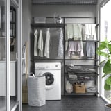 BOAXEL wall storage in laundry area with mesh baskets, drying rack, washing machine.