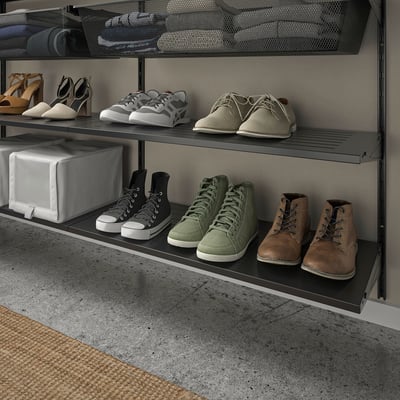 Shoe rack with various footwear: heels, flats, sandals, sneakers, boots.