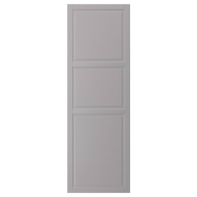 A grey BODBYN kitchen cabinet door with beveled panels. It has a rectangular shape and smooth lacquered fiberboard surface.