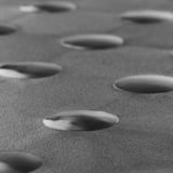 Close-up of textured, anti-slip surface with evenly spaced circular patterns.