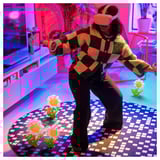 A person playing vr games on a pixelated gaming rug. The rug has edges to sense and avoid falling off, and an anti-slip back.