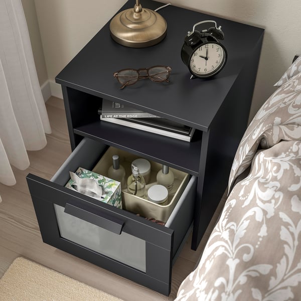 Black nightstand, open drawer, lamp, clock, etc. BRIMNES series for bedroom.