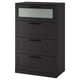 Black BRIMNES chest with frosted glass top drawer, sleek modern design, four drawers, wall anchorable.