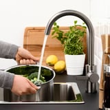 Washing broccoli.